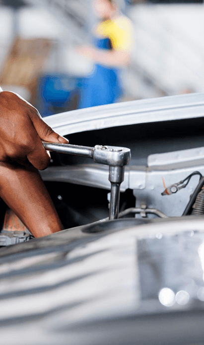 Mechanic performing brake service