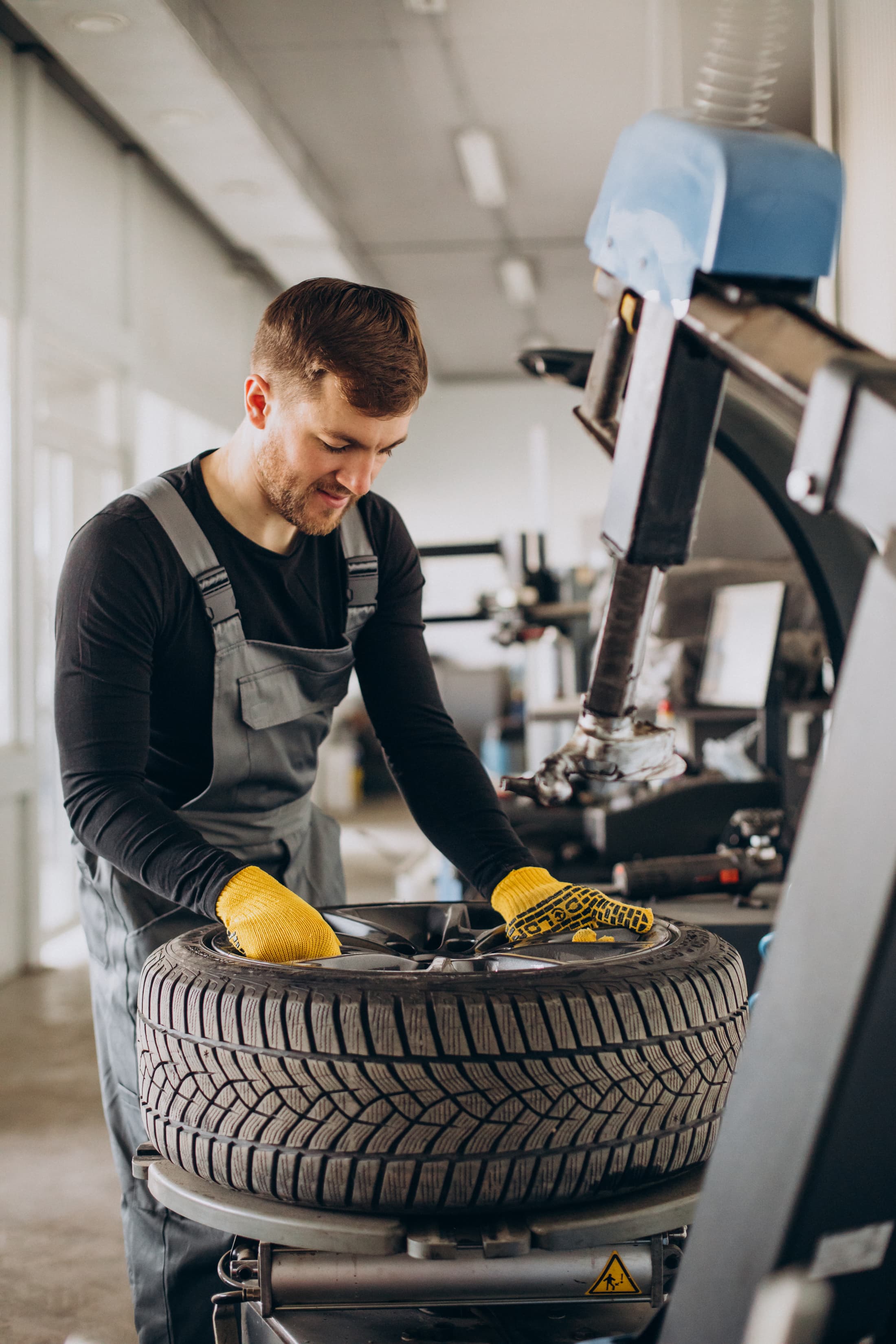 Mechanic repairing a tire