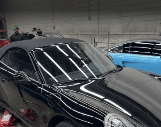 Black convertible in the workshop