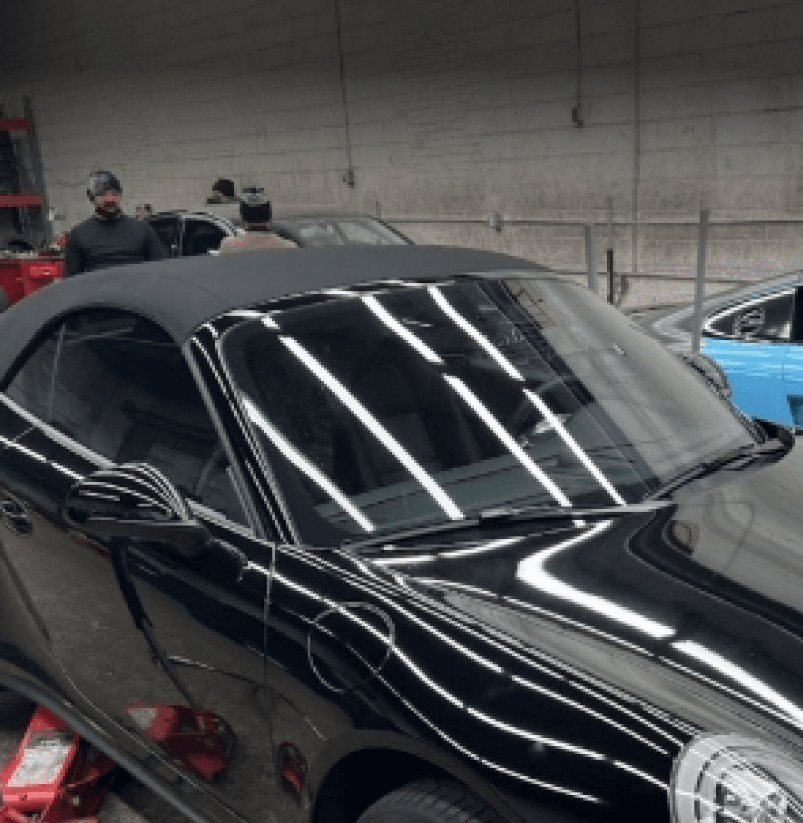 Close-up of a black convertible in the workshop